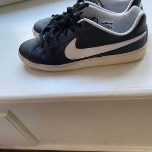 Black leather and white Nike Sneaker